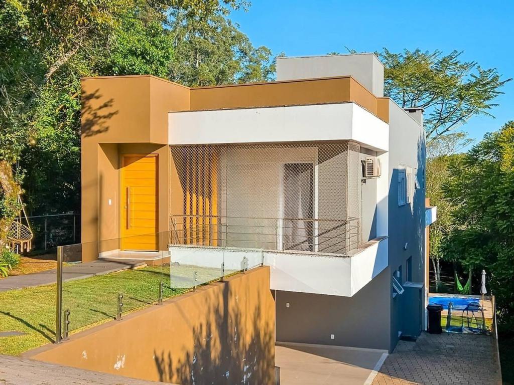 Casa de condomínio 4 dormitórios